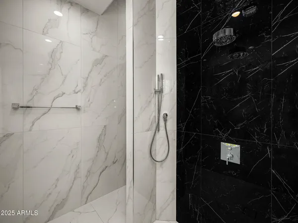 a kitchen with white cabinets and refrigerator