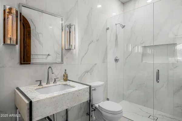 a bathroom with a shower and a toilet