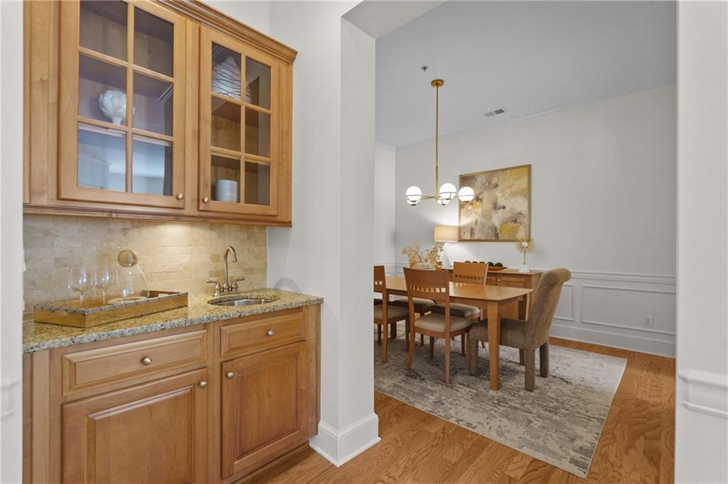 11945 Dancliff Trace Alpharetta, GA 30009 - Photo 14 of 48 a view of a dining room and chairs