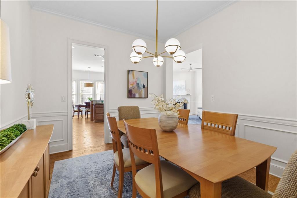 11945 Dancliff Trace Alpharetta, GA 30009 - Photo 16 of 48 a view of a dining room with furniture and wooden floor