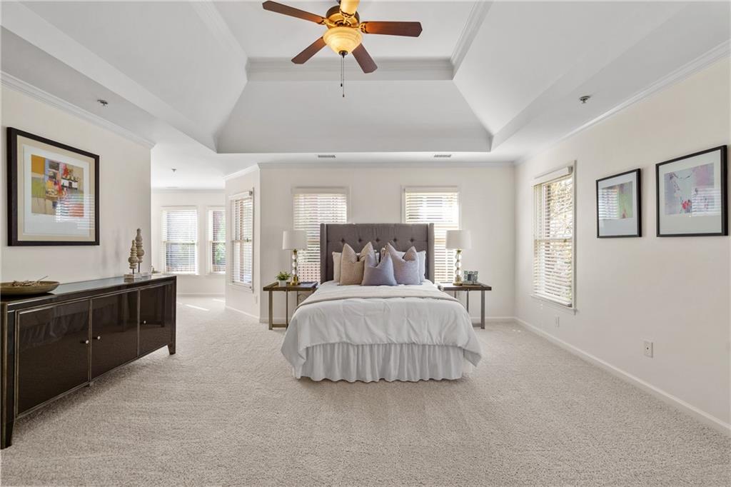 11945 Dancliff Trace Alpharetta, GA 30009 - Photo 20 of 48 a bedroom with a bed and wooden floor