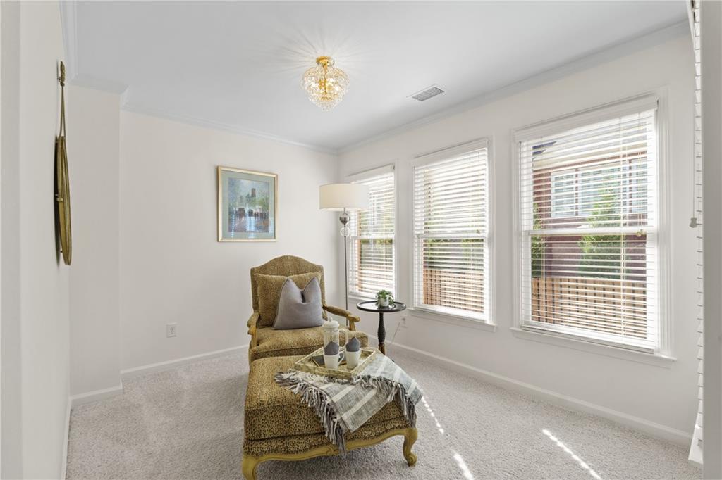 11945 Dancliff Trace Alpharetta, GA 30009 - Photo 23 of 48 a living room with furniture and a window