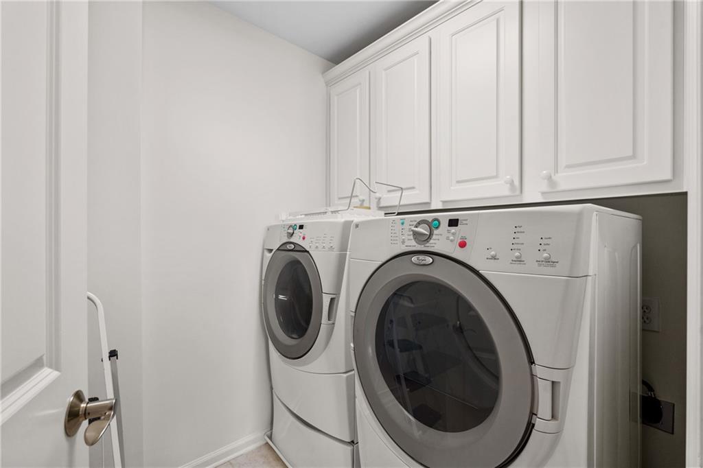 11945 Dancliff Trace Alpharetta, GA 30009 - Photo 30 of 48 a utility room with dryer and washer