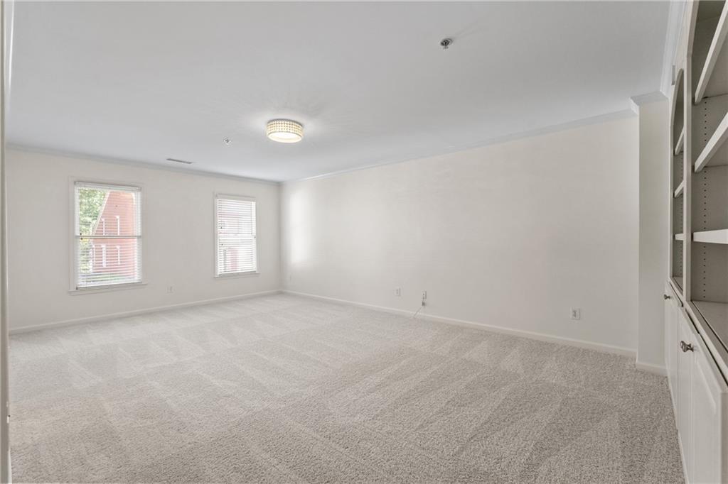11945 Dancliff Trace Alpharetta, GA 30009 - Photo 31 of 48 an empty room with windows
