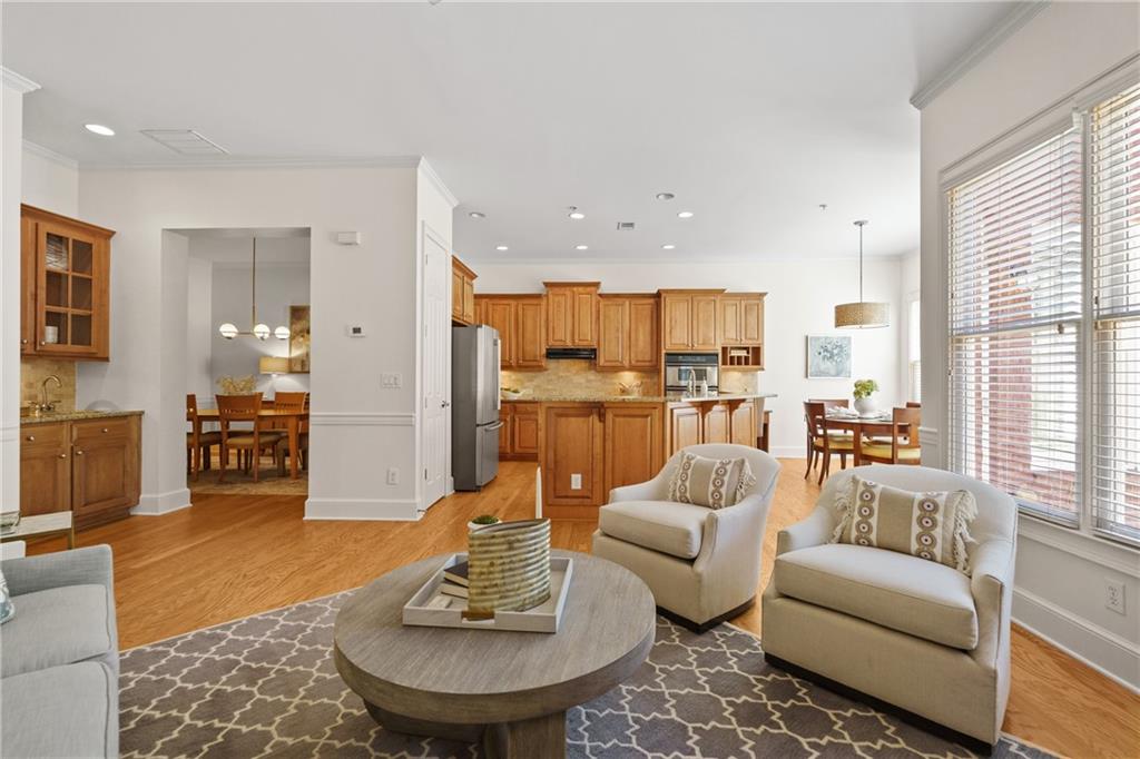 11945 Dancliff Trace Alpharetta, GA 30009 - Photo 6 of 48 a living room with furniture kitchen and a large window