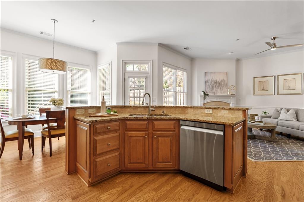 11945 Dancliff Trace Alpharetta, GA 30009 - Photo 7 of 48 a kitchen with lots of counter top space and dining table