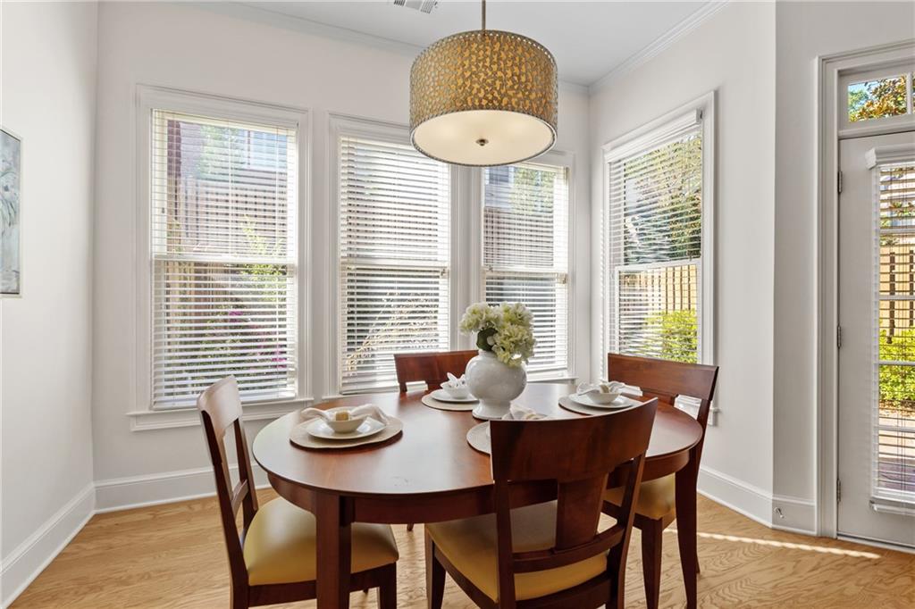 11945 Dancliff Trace Alpharetta, GA 30009 - Photo 9 of 48 a dining room with furniture and window