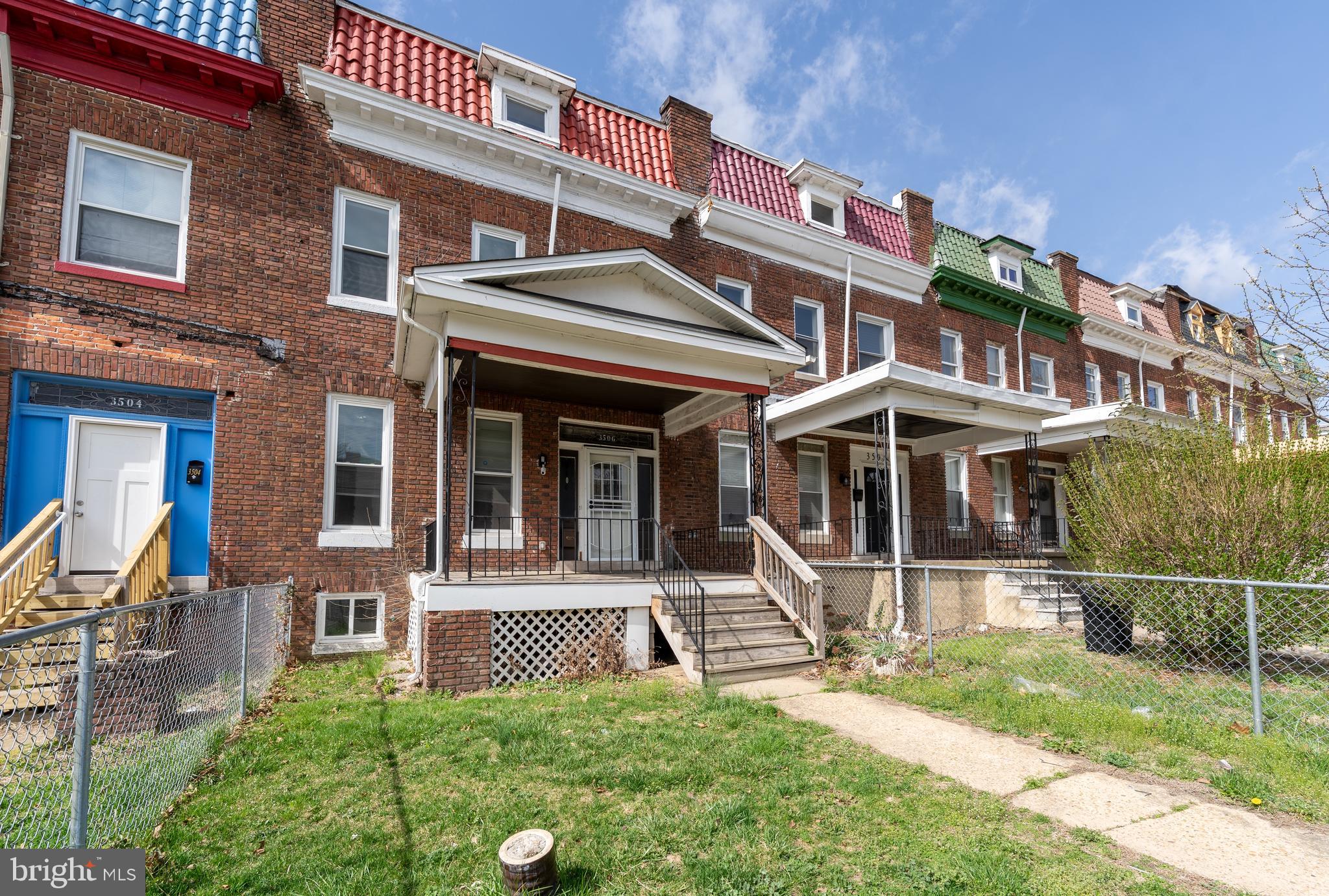 3506 Reisterstown Road Baltimore, MD 21215 - Photo 1 of 32 a front view of a house with a yard
