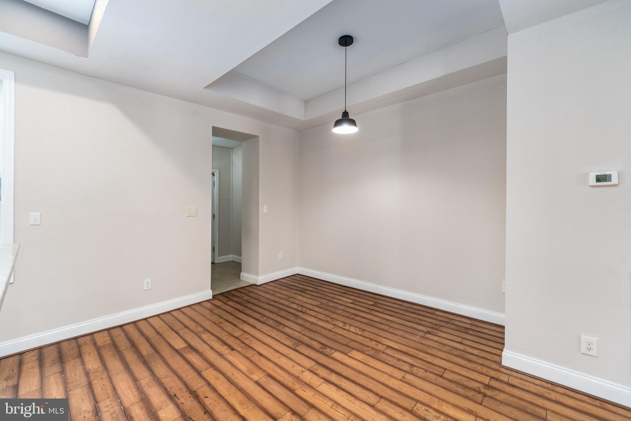 3506 Reisterstown Road Baltimore, MD 21215 - Photo 11 of 32 a view of a room with wooden floor