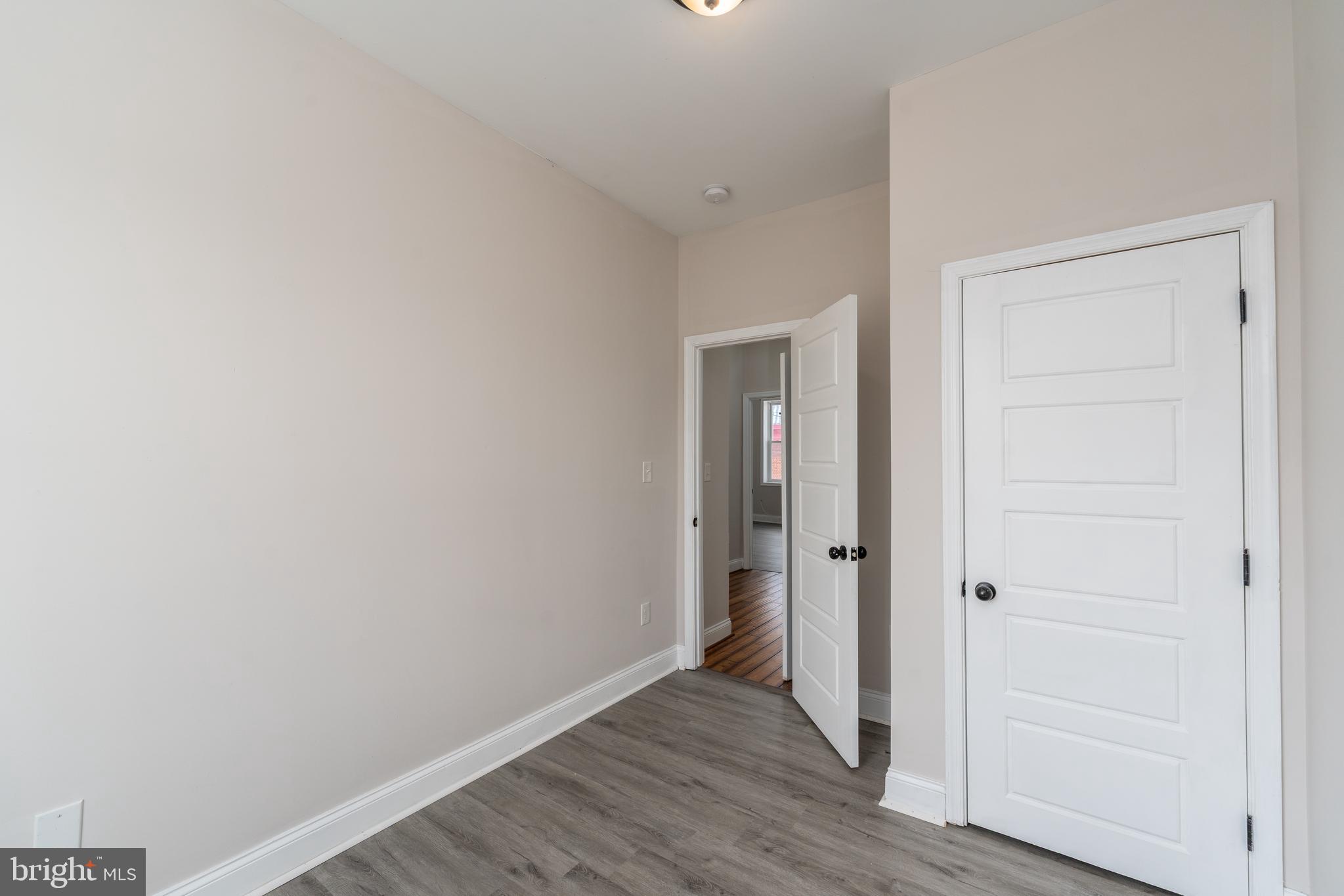 3506 Reisterstown Road Baltimore, MD 21215 - Photo 20 of 32 a view of a hallway with wooden floor