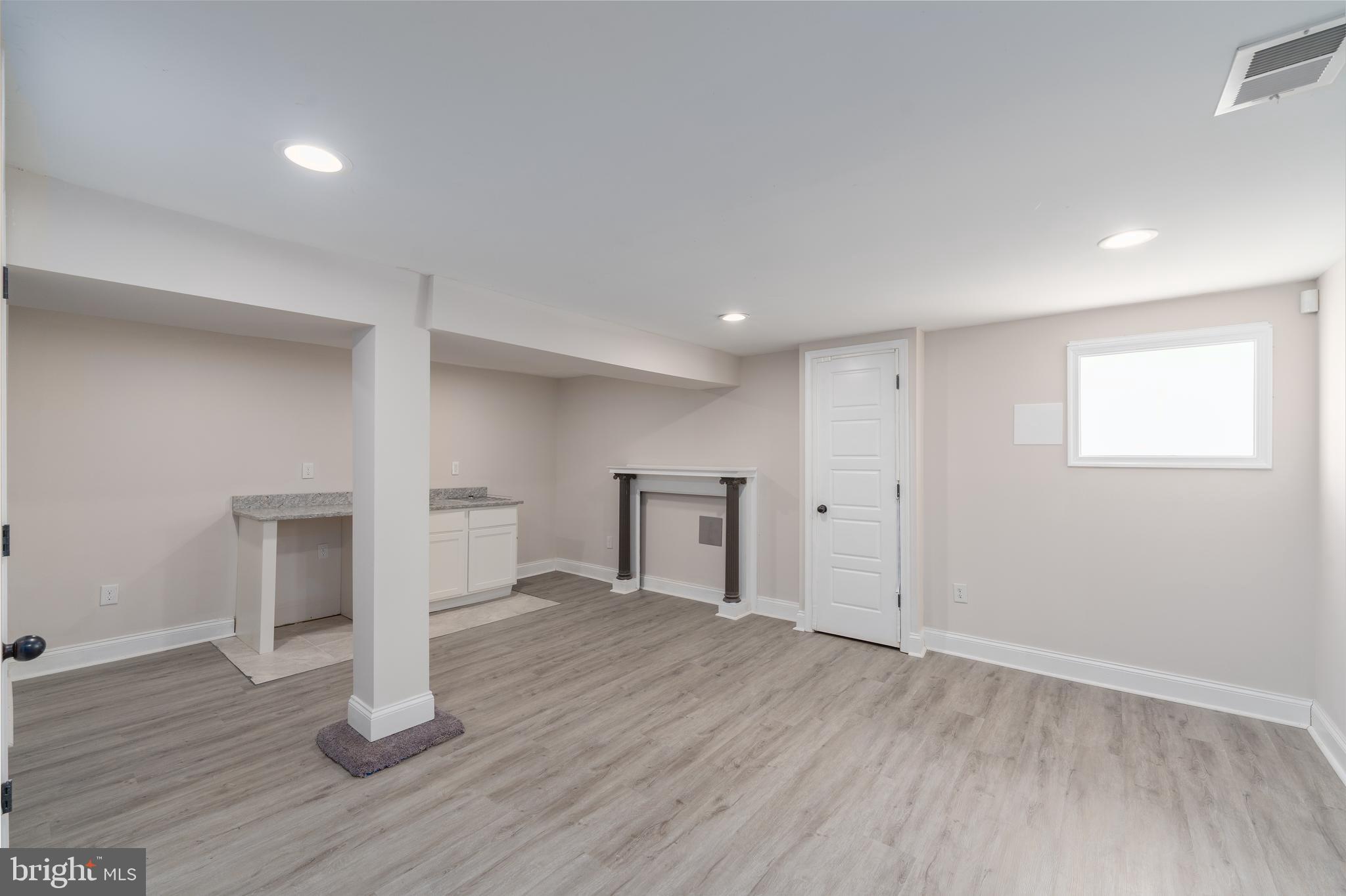 3506 Reisterstown Road Baltimore, MD 21215 - Photo 24 of 32 a view of empty room with wooden floor
