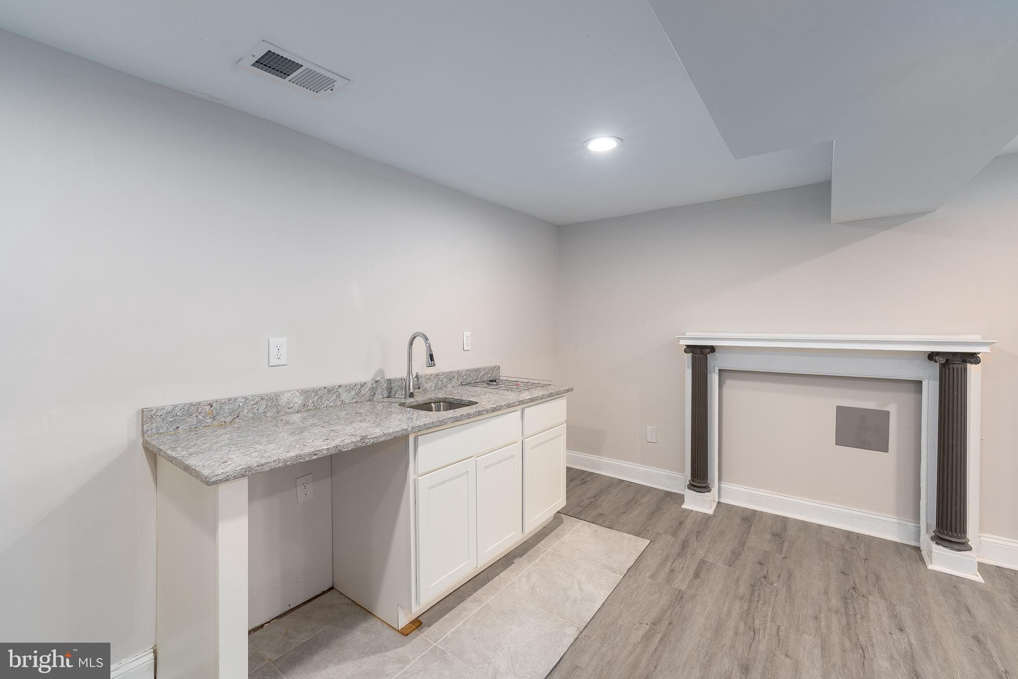 3506 Reisterstown Road Baltimore, MD 21215 - Photo 25 of 32 a utility room with a sink washer and dryer