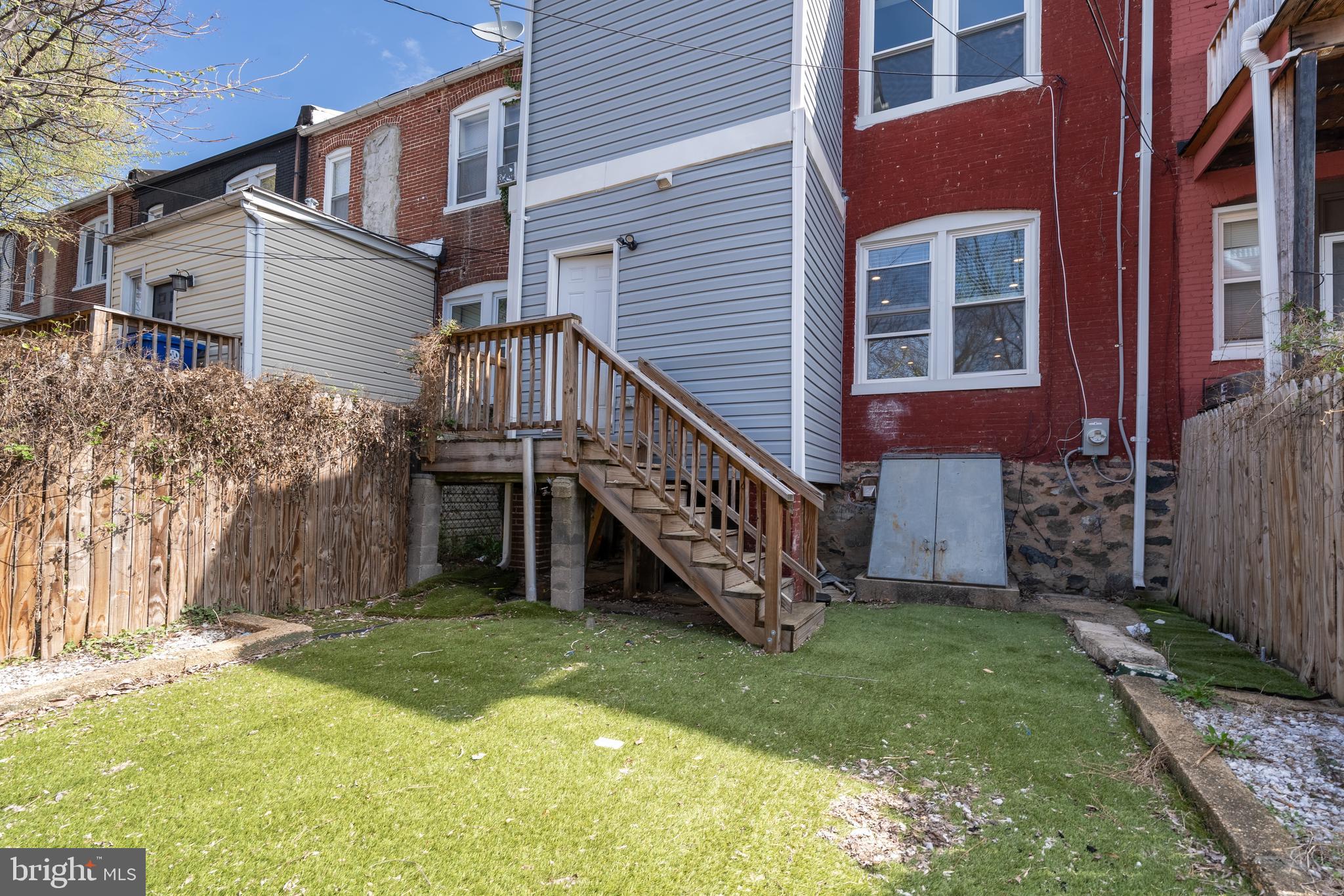 3506 Reisterstown Road Baltimore, MD 21215 - Photo 30 of 32 a view of a house with a yard
