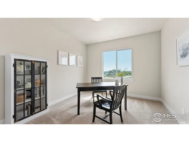 a kitchen with a table and chairs in it