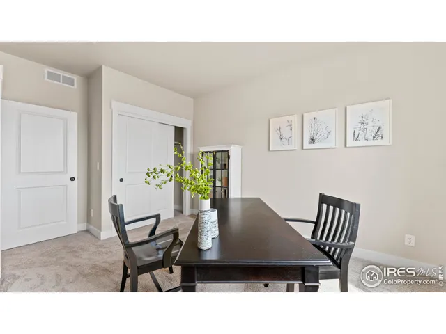 a living room with furniture and a chair