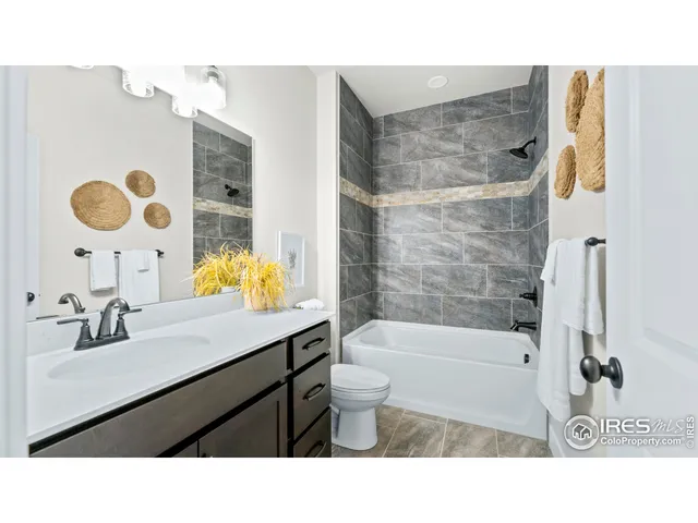 a bathroom with a sink a toilet and bathtub