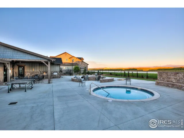 a indoor swimming pool with outdoor seating and yard
