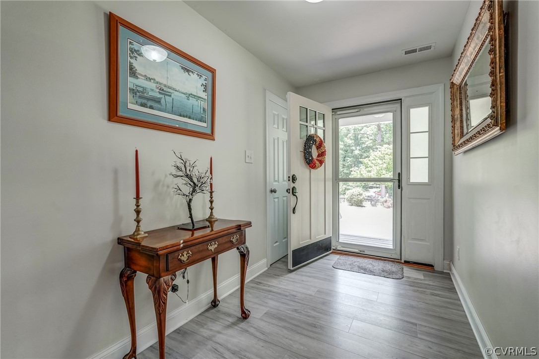 3039 Quaker Road Quinton, VA 23141 - Photo 19 of 49 a view of a hallway with workspace
