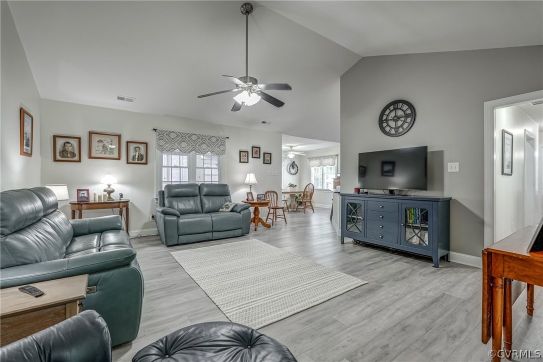 3039 Quaker Road Quinton, VA 23141 - Photo 23 of 49 a living room with furniture kitchen view and a wooden floor