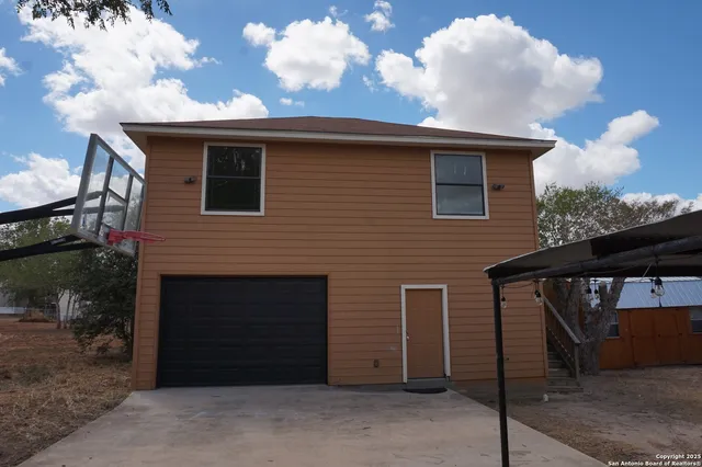 a view of a house and a yard