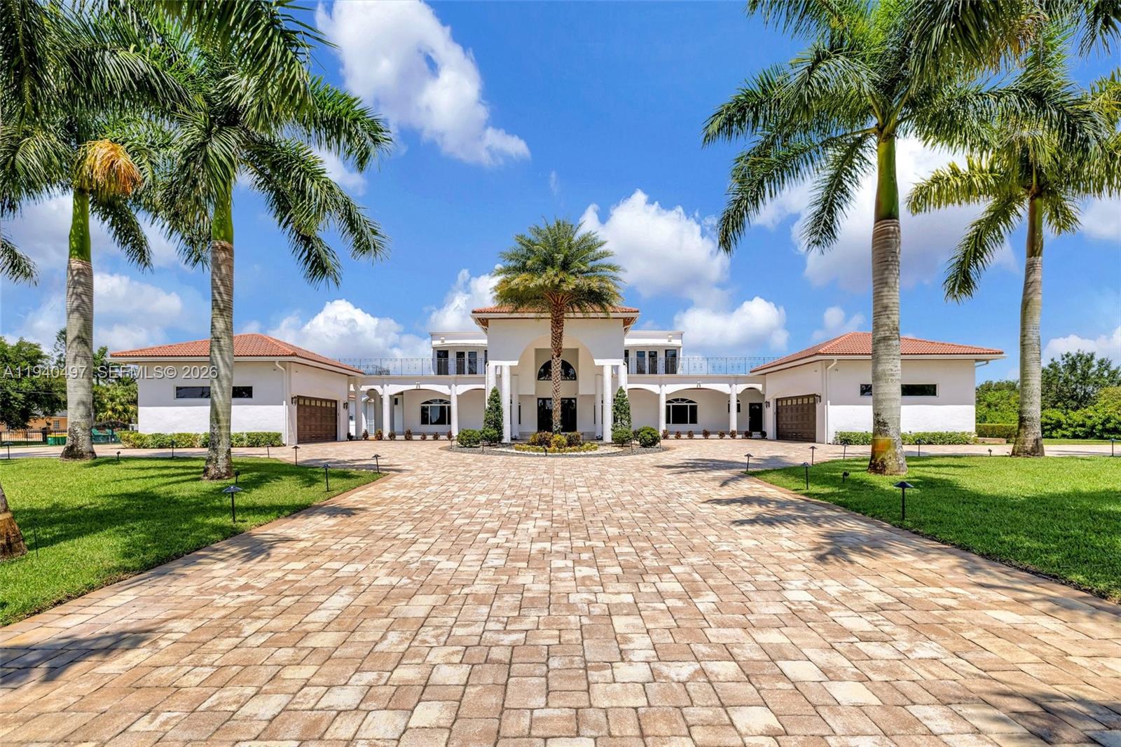 4610 Southwest 178th Avenue Southwest Ranches, FL 33331 - Photo 4 of 100 a front view of a house with a yard and palm tree