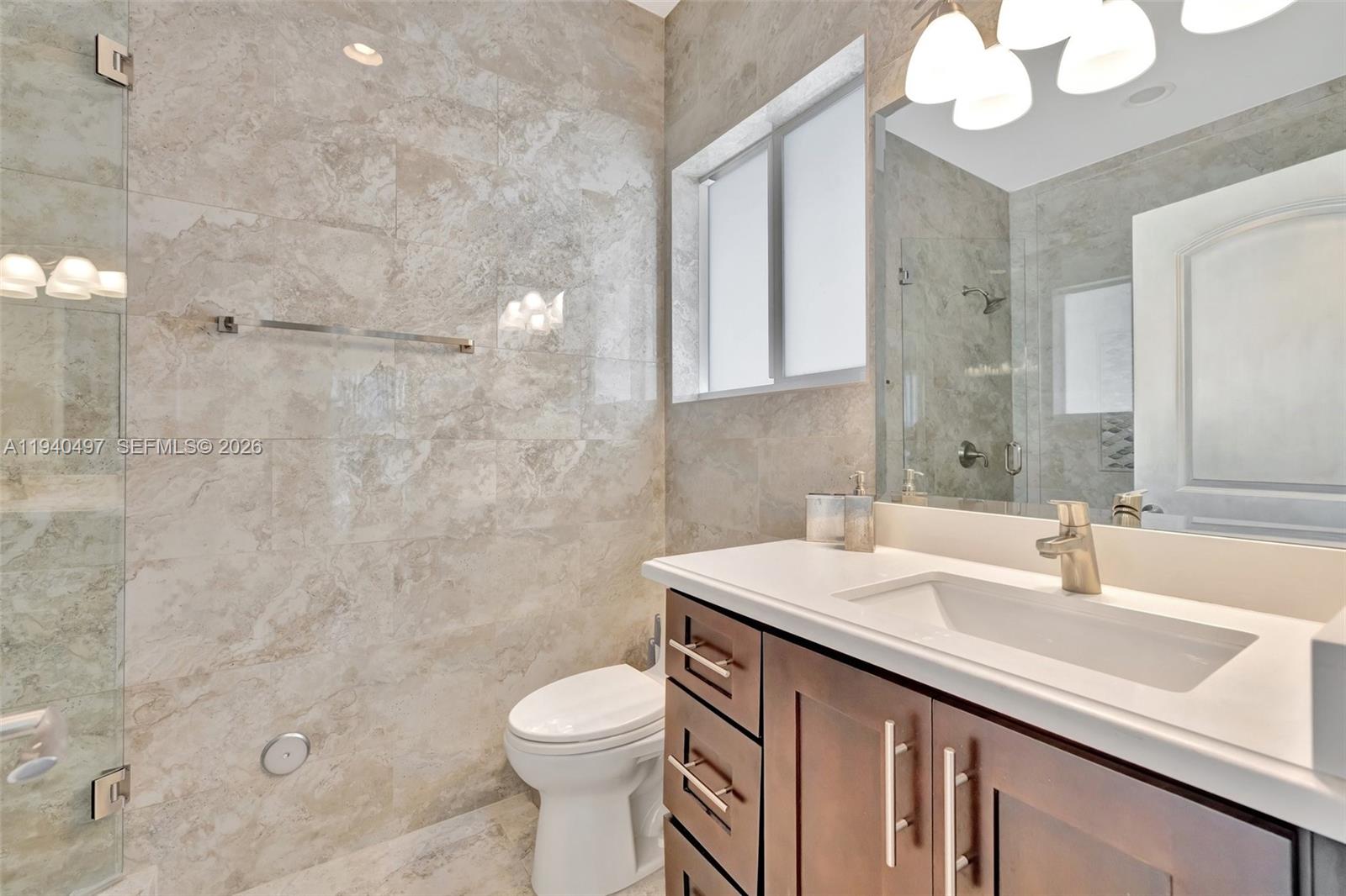 4610 Southwest 178th Avenue Southwest Ranches, FL 33331 - Photo 44 of 100 a bathroom with a sink a toilet and shower