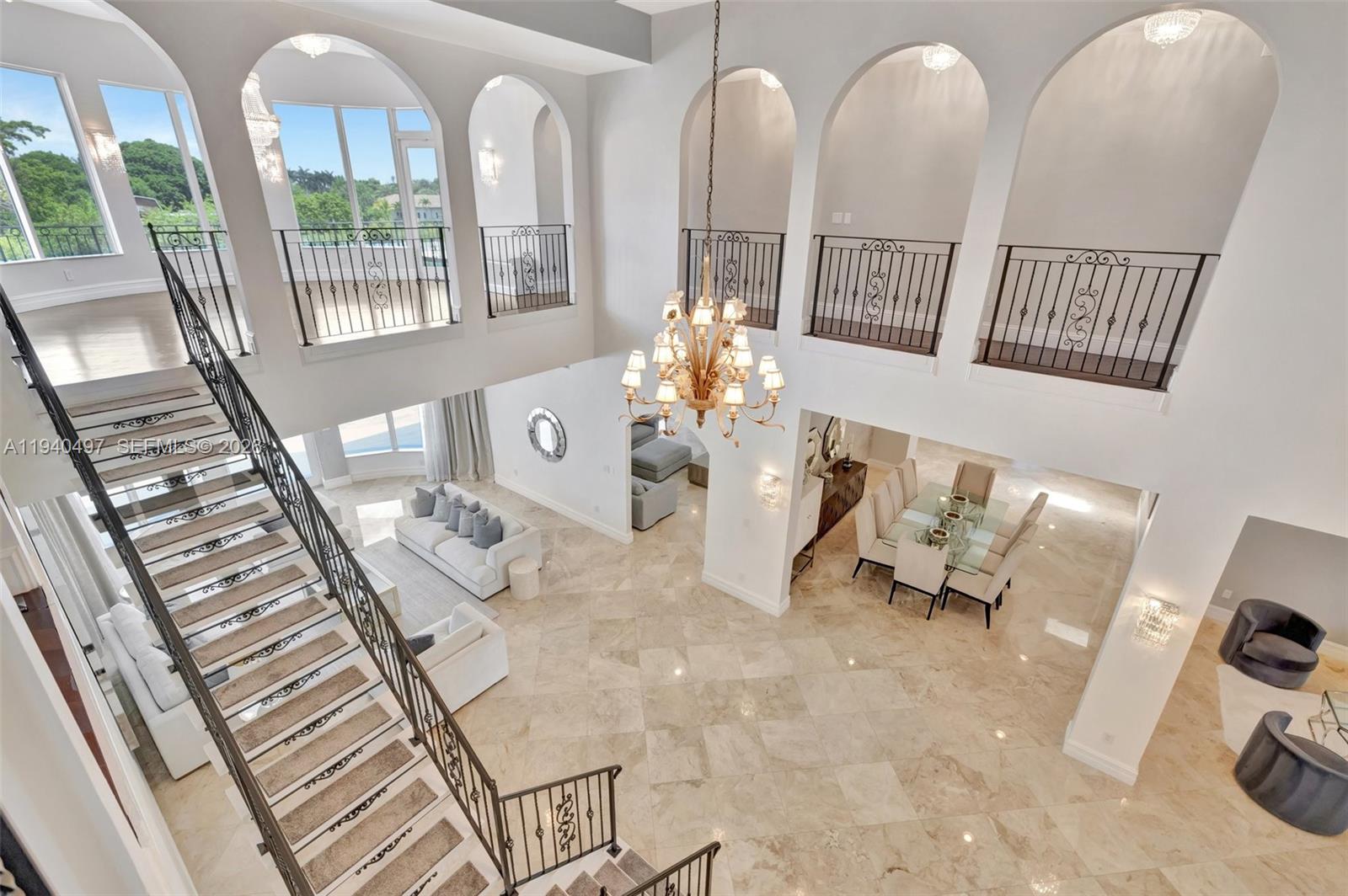 4610 Southwest 178th Avenue Southwest Ranches, FL 33331 - Photo 52 of 100 a view of living room filled with furniture and chandelier