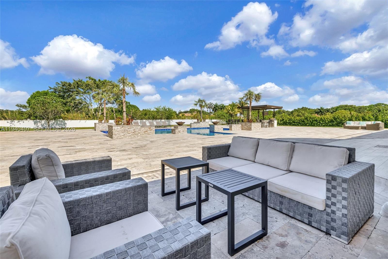 4610 Southwest 178th Avenue Southwest Ranches, FL 33331 - Photo 54 of 100 a view of a terrace with couches and sky view