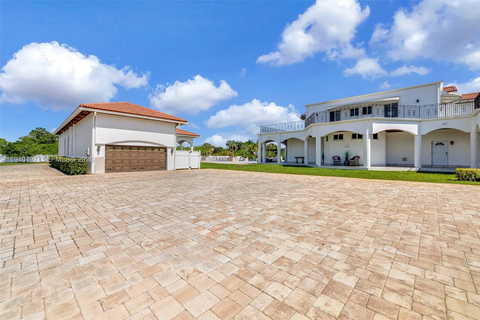 4610 Southwest 178th Avenue Southwest Ranches, FL 33331 - Photo 64 of 100 a front view of a house with a yard