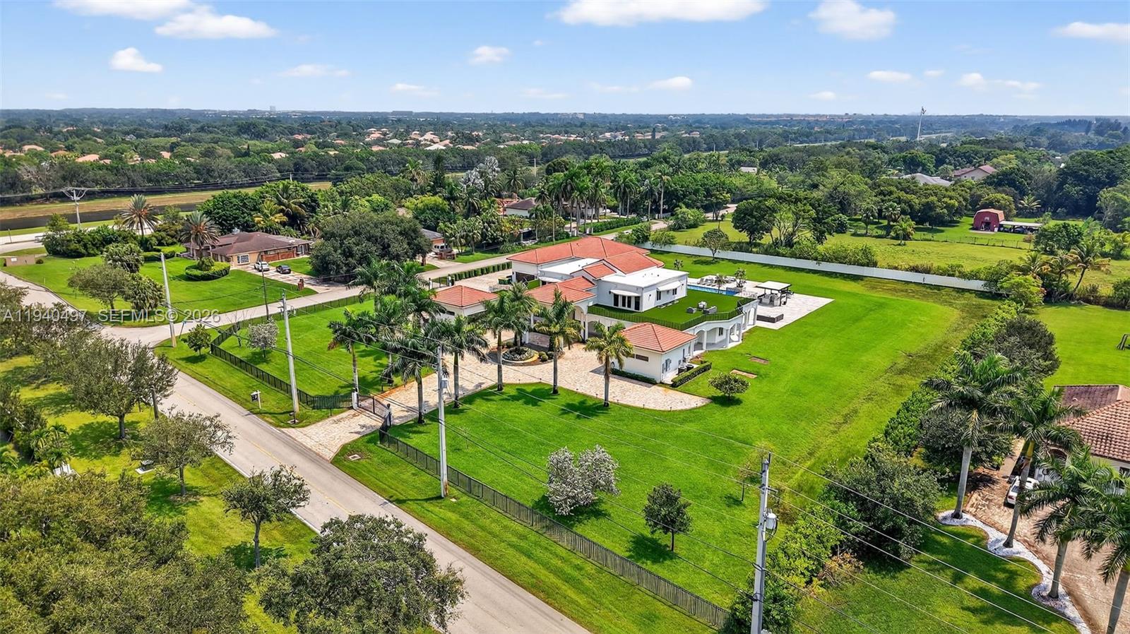4610 Southwest 178th Avenue Southwest Ranches, FL 33331 - Photo 8 of 100 an aerial view of a house with a garden and swimming pool