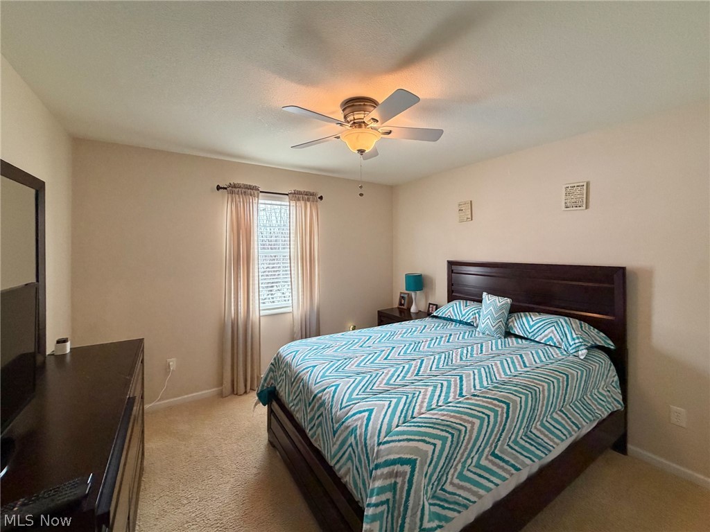 1343 Courtland Road Weirton, WV 26062 - Photo 32 of 50 Bedroom with ceiling fan and light carpet