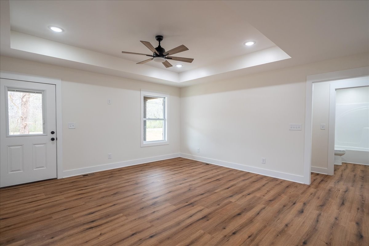 3987 Buffalo Road Summertown, TN 38483 - Photo 9 of 26 a view of empty room with wooden floor and fan