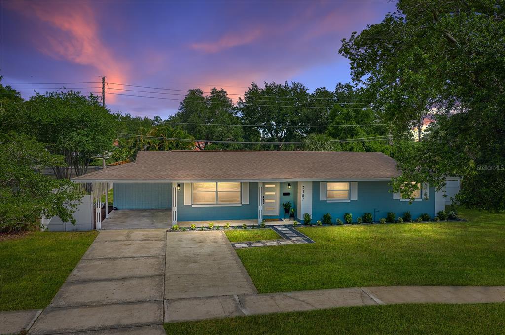3187 Plaza Terrace Drive Orlando, FL 32803 - Photo 1 of 1 a front view of a house with a yard and trees