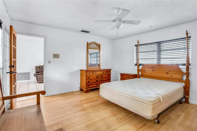 a bedroom with a bed and a table in it