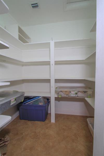 98 Seminole Lane Boca Raton, FL 33487 - Photo 13 of 42 a view of room with cabinet and a shelf