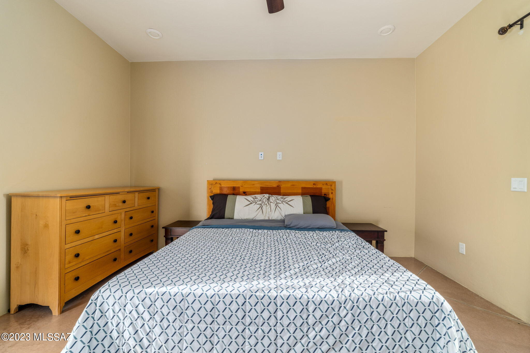 5670 Triangle X Place Tucson, AZ 85713 - Photo 26 of 36 a bedroom with a bed and a window