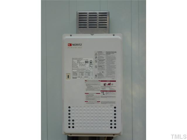 1714 Euclid Road Durham, NC 27713 - Photo 25 of 25 Pix of the tankless water heater on the back of the house, this brand is Noritz, so you do not have to worry about a water heater and changing the heating elements in this house. There is also a security system hook up if desired