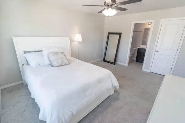 a white toilet sitting next to a bathroom sink
