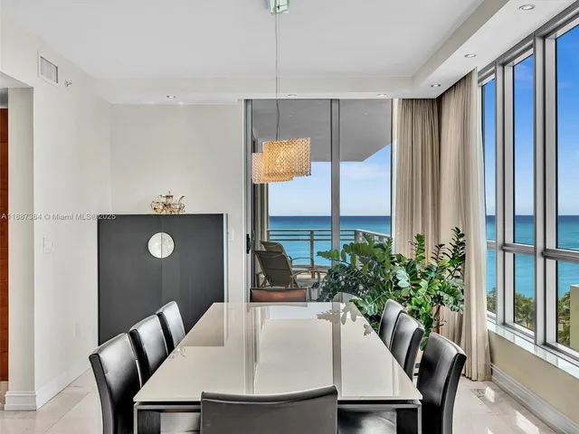 a large kitchen with stainless steel appliances granite countertop a sink and cabinets