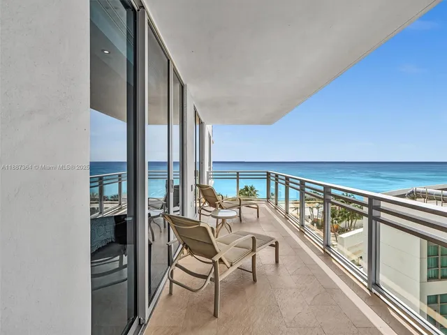 a view of a balcony with chairs