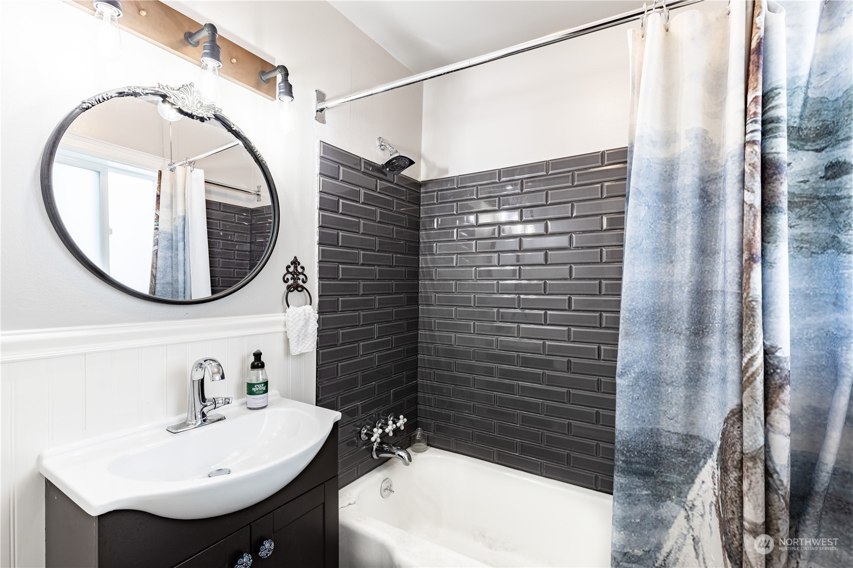 720 Greenleaf Avenue Burlington, WA 98233 - Photo 15 of 31 a bathroom with a sink a mirror and a shower