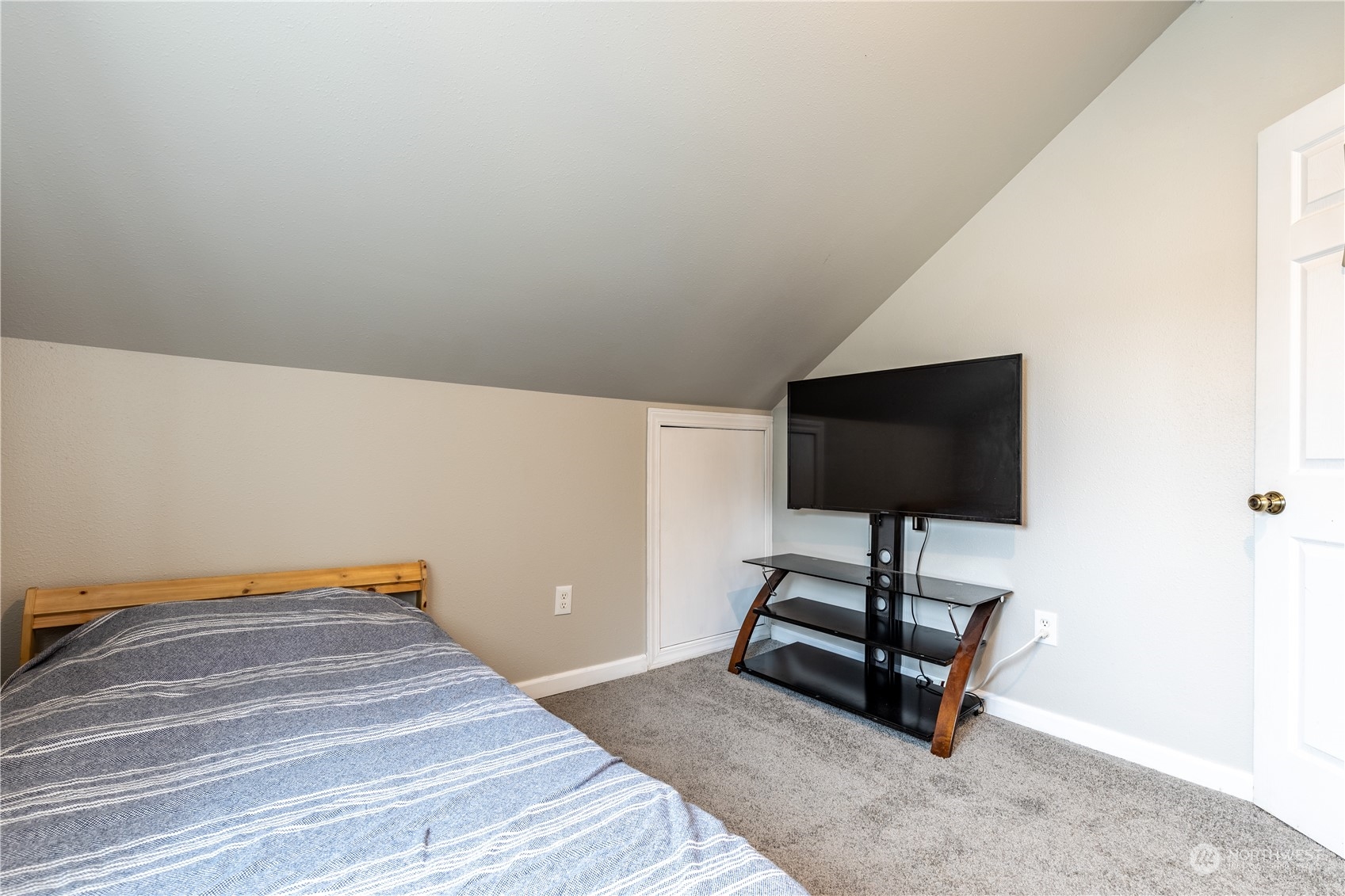 720 Greenleaf Avenue Burlington, WA 98233 - Photo 17 of 31 a bedroom with a bed and a flat screen tv
