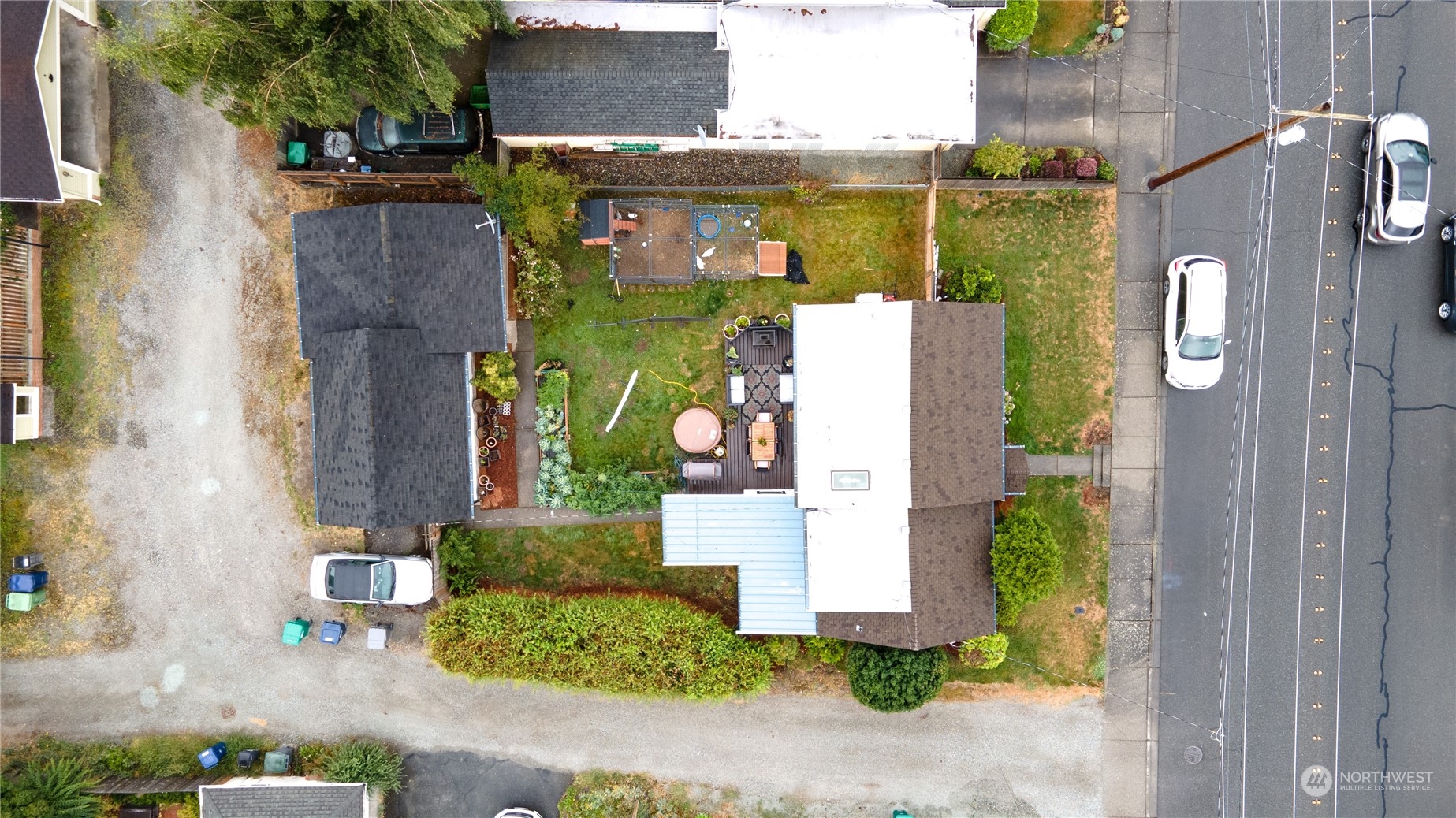 720 Greenleaf Avenue Burlington, WA 98233 - Photo 30 of 31 an aerial view of a house with a yard and garden