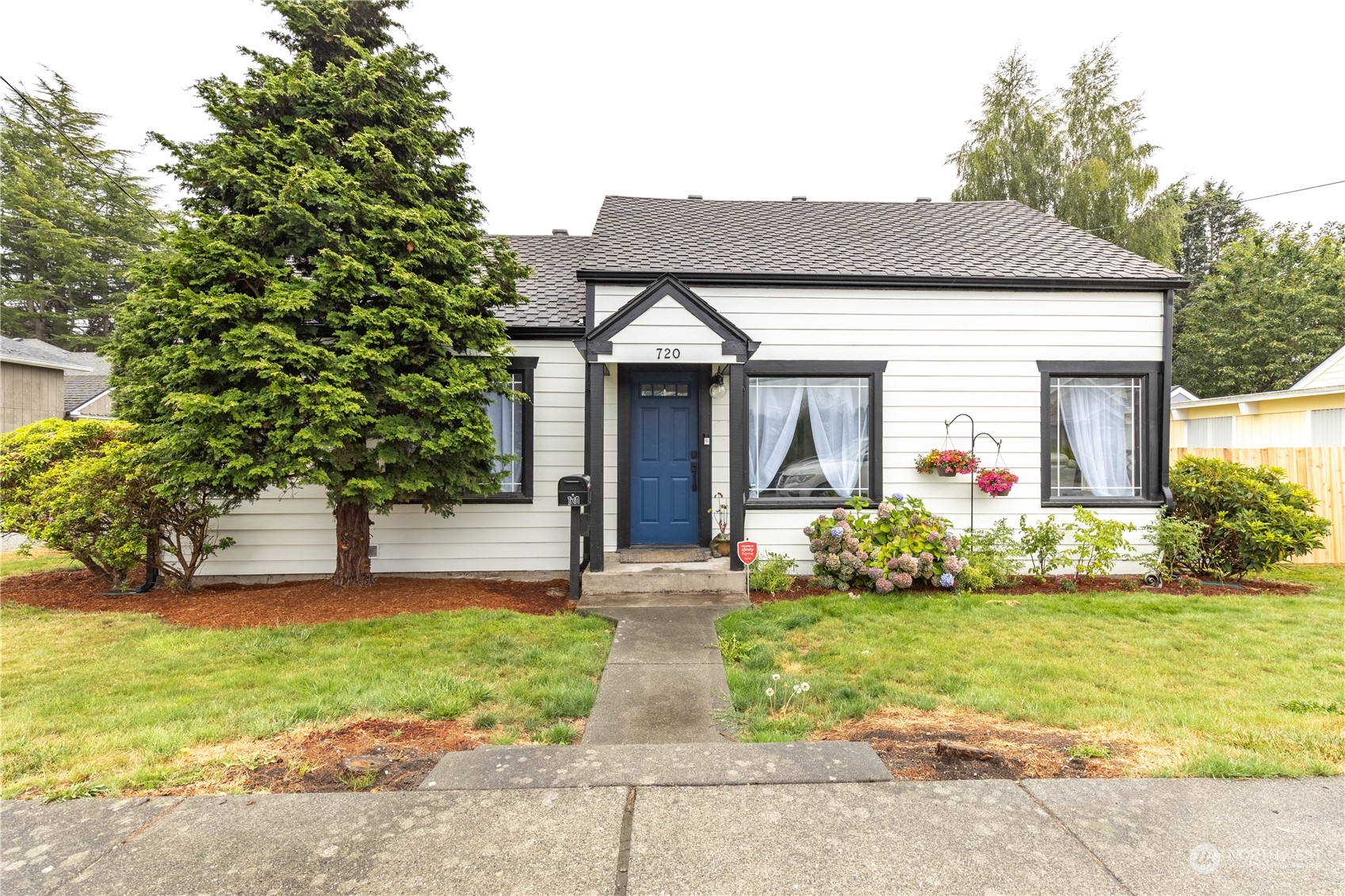 720 Greenleaf Avenue Burlington, WA 98233 - Photo 4 of 31 a front view of a house with garden