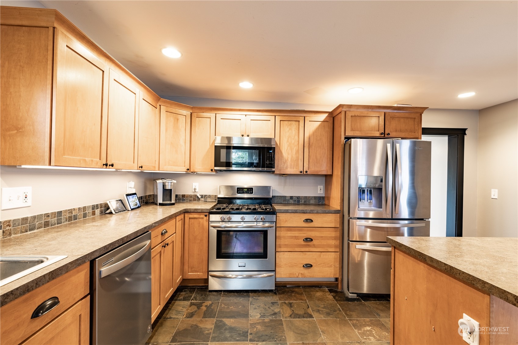 720 Greenleaf Avenue Burlington, WA 98233 - Photo 6 of 31 a kitchen with stainless steel appliances granite countertop a refrigerator stove and sink
