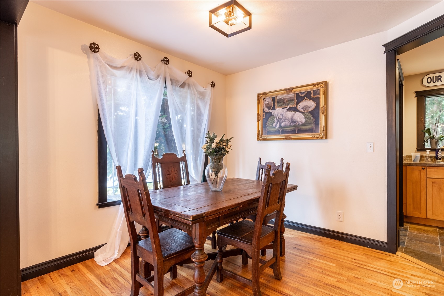 720 Greenleaf Avenue Burlington, WA 98233 - Photo 9 of 31 a view of a dining room with furniture and wooden floor