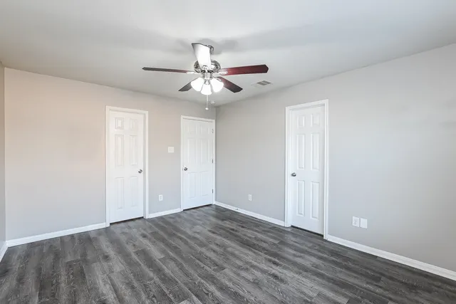 a bathroom with a sink vanity and a toilet