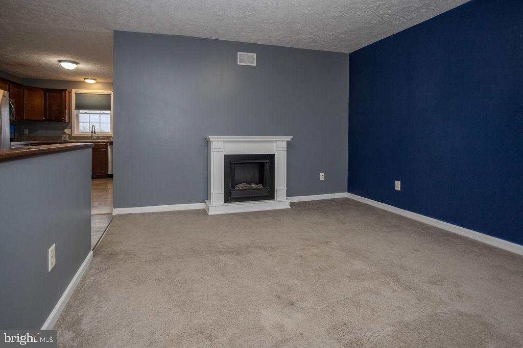 4482 Fort McCord Road Chambersburg, PA 17202 - Photo 13 of 47 a view of an empty room with kitchen and a window