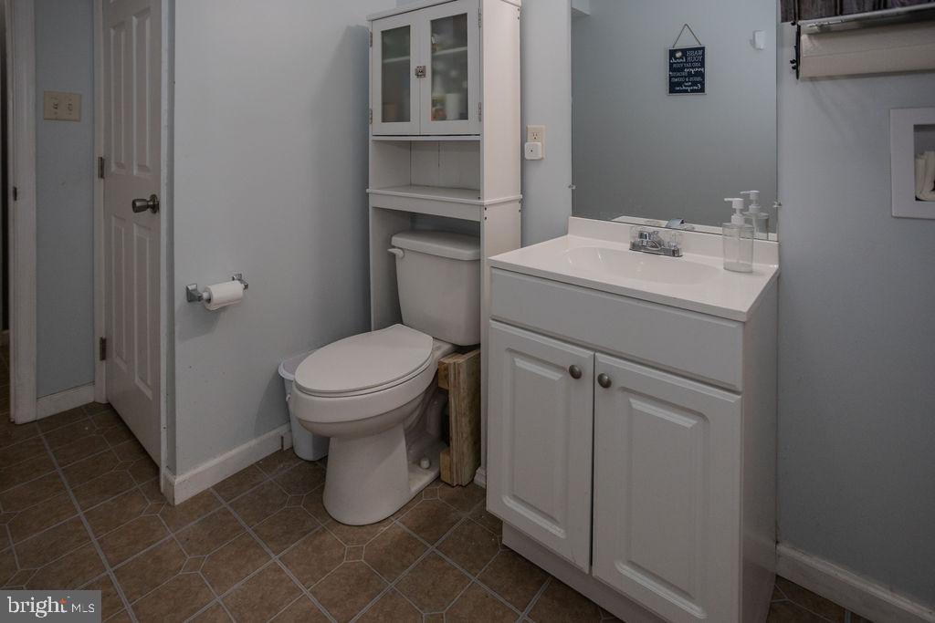 4482 Fort McCord Road Chambersburg, PA 17202 - Photo 37 of 47 a bathroom with a sink toilet and a mirror