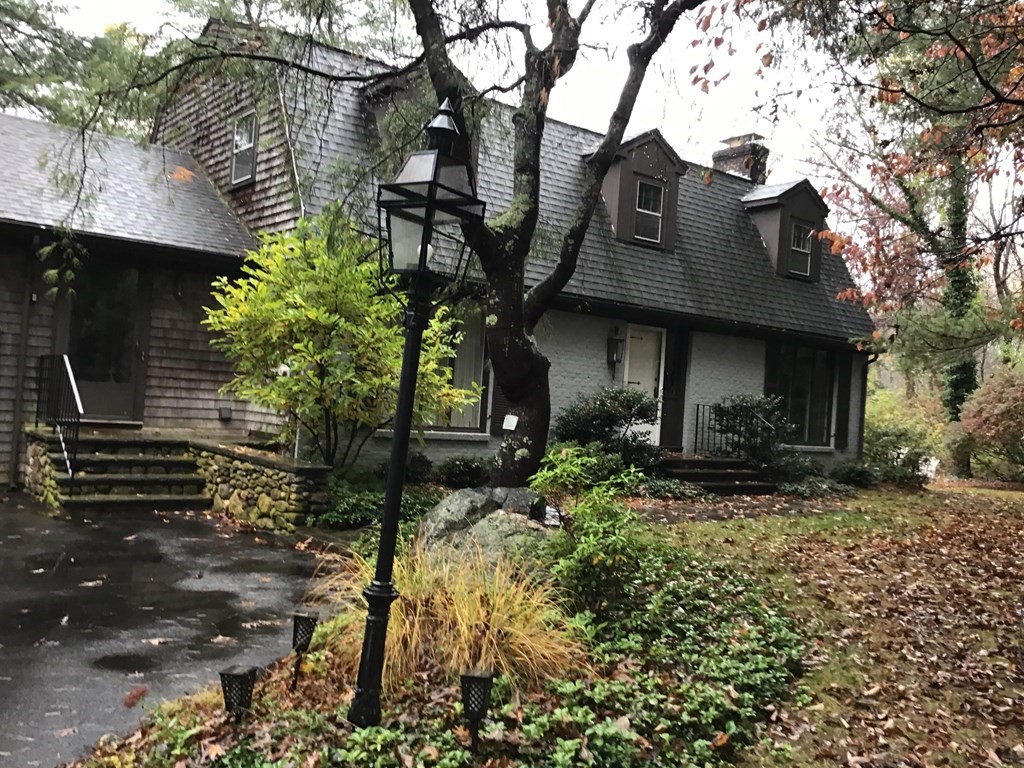 126 Conant Road Weston, MA 02493 - Photo 1 of 1 a front view of a house with a yard